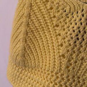 Yellow crochet crop top.